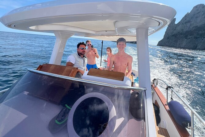 Capri and Blue Grotto Small Group Boat Tour - Inside the grottos: Saints, Green Grotto, Sailors’ Cave, and more color than you expect