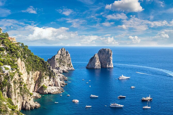 Capri Island Boat Tour from Amalfi with Snorkeling | Small Group - Morning sail: Lovers’ Arch, watchtowers, and sea caves you only see by boat