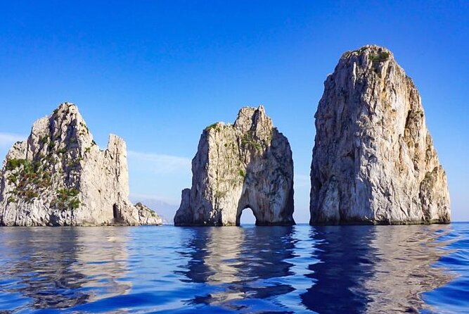 Capri Positano and Amalfi Ischia Private Boat Tour from Sorrento - Your Grottos-and-Photo Stop Plan: From Grotta Rossa to Punta Campanella