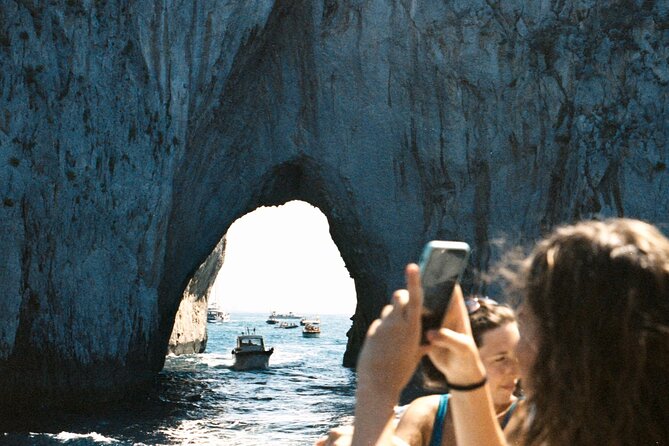 Capri Private Boat Excursion with Faraglioni and Blue Grotto - White Grotto and Natural Arch: the cave circuit before the big hits
