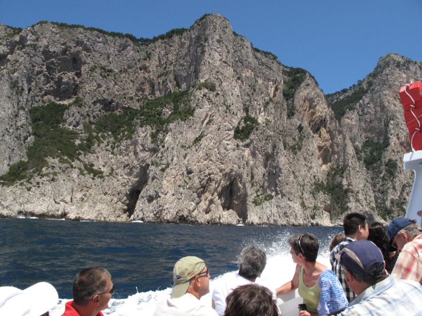 Capri: Private Island Boat Tour with Snorkeling and Swimming - Faraglioni Rocks and the Natural Arch: the iconic hits from sea level