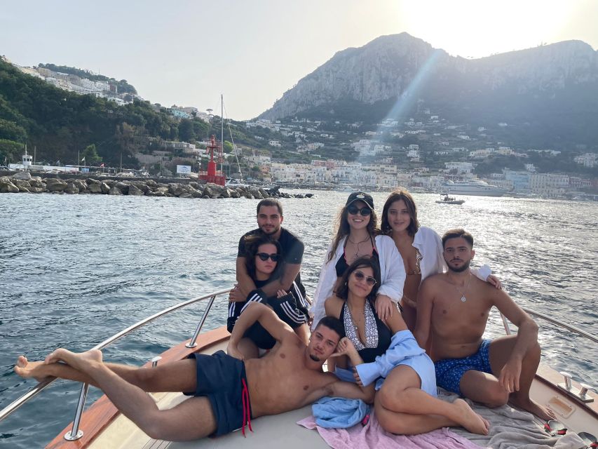 Discover Capri's Hidden Gems: Group Tour Boat Experience - Capri by Boat: Faraglioni, Green Grotto, and Marina Piccola