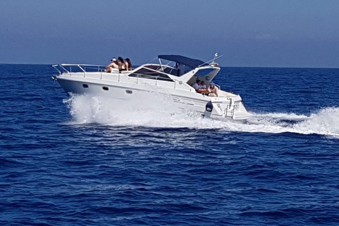 Excursion to Capri by shared boat departure from Sorrento - Midday from the water: Villa Jovis, Capri swimming, and the cave approach