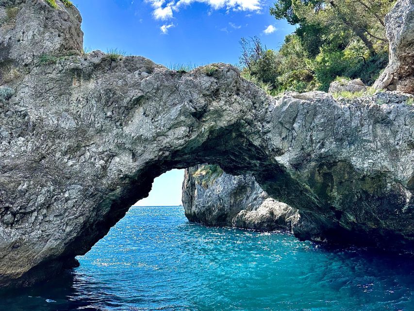 From Amalfi: 7H Amalfi Coast - Group Tour by boat - Conca dei Marini, the Natural Arch, and the Marmorata waterfalls viewpoint