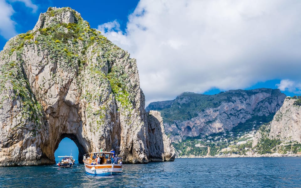 From Amalfi: Group Boat Tour to Capri with Swimming - Onboard food and drinks: prosecco, limoncello, cookies, and water