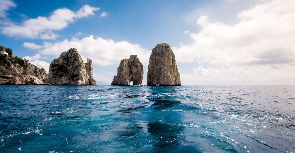 From Positano: Full-Day Boat Trip to Capri - On the water: grottos, Faraglioni, and Punta Carena’s showstopper