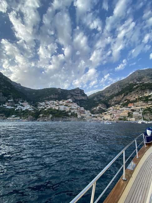 From Sorrento: Amalfi Coast Small Group Boat Day Tour - Onboard comfort: prosecco, beer, fruit, showers, and the reality of shade