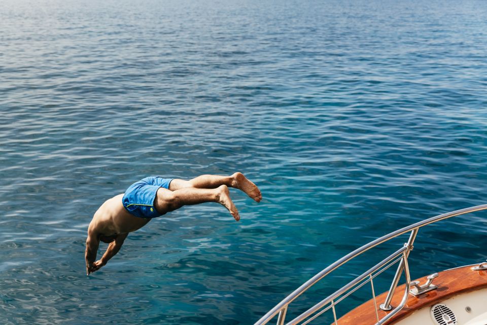 From Sorrento: Capri Boat Tour with Blue Grotto Visit - Green Grotto and Punta Carena Lighthouse: classic postcard angles