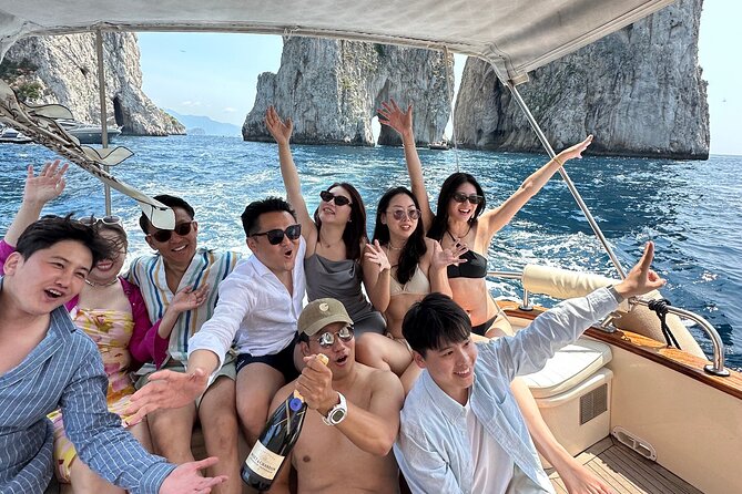 Luxury private boat tour to Capri and Blue Grotto on Gozzo 32 ft - Past the Faraglioni sea stacks: the classic Capri view from the water
