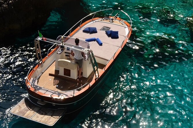 Private boat trip to Capri - I Faraglioni close-up: passing under the arch for photos