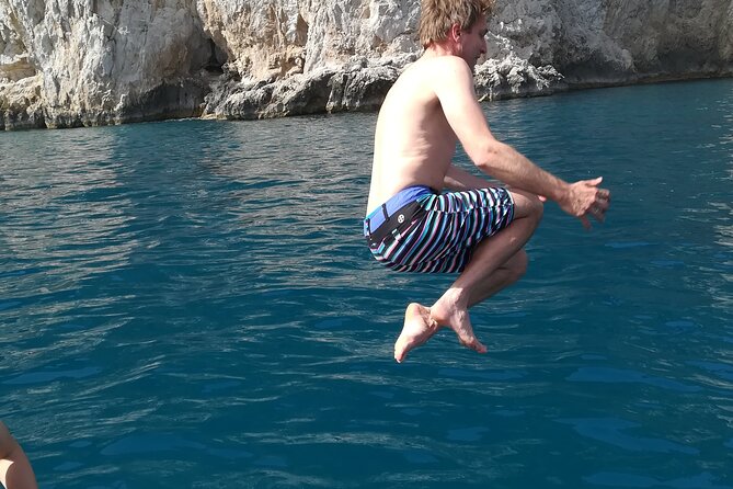 Private tour with fishing, tour of Capri and lunch on board - White Grotta, Grotta Verde, and Grotta dei Santi: short stops, big visuals