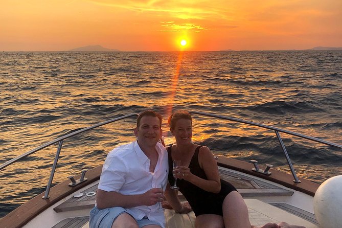 Sunset Boat Tour from Sorrento to Capri - Stop 2: I Faraglioni at golden hour
